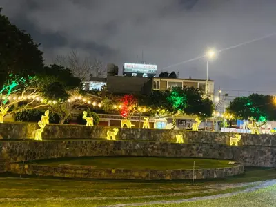 a fountain in a park at night with lights at Apartamento San Borja in Lima