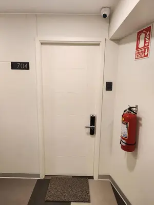 a white door in a room with a fire hydrant at Elegante Departamento de Estreno en Centro Financiero in Lima
