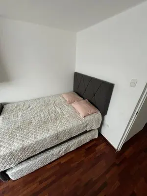 a small bedroom with a bed in a room at Apartment with 3 bedrooms near the sea in Miraflores in Lima
