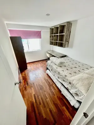 a bedroom with two beds and a window at Apartment with 3 bedrooms near the sea in Miraflores in Lima