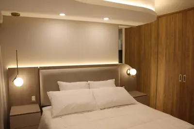a bedroom with a bed with two white pillows at Ama Loft Miraflores in Lima