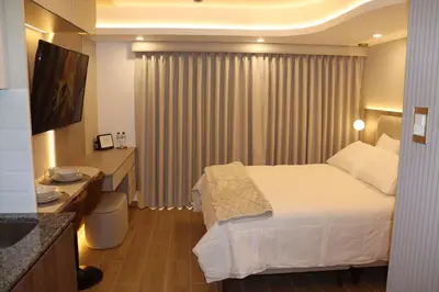 a hotel room with a bed and a bathroom at Ama Loft Miraflores in Lima