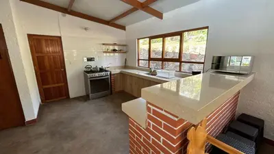 a kitchen with a stove and a counter top at Casa Huerta Vista Bonita in Canta