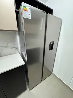 a stainless steel refrigerator in a kitchen at Cozy Room in Miraflores with rooftop pool in Lima