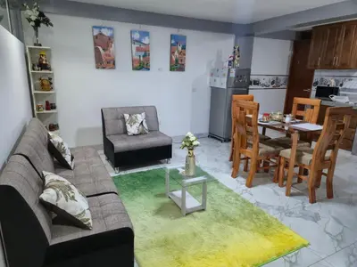 a living room with a couch and a table at Camino del Sol in Cusco