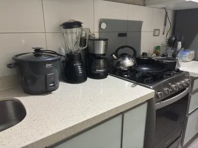 a kitchen counter with a stove and a blender at Three-bedroom apartment in San Miguel in Lima