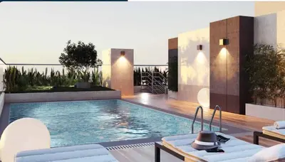 a swimming pool in the middle of a house at moderno departamento con vista al mar en miraflores in Lima