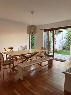 a dining room with a wooden table and chairs at Casa amplia y acogedora, en Miraflores in Lima