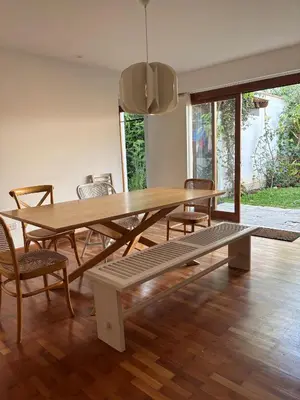 a dining room with a wooden table and chairs at Casa amplia y acogedora, en Miraflores in Lima