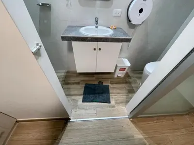 a bathroom with a sink and a toilet at Casa de Moño - Moderno apartamento cerca a Aeropuerto y Terminal Terrestre in Lima