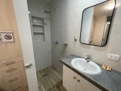 a bathroom with a sink and a mirror at Casa de Moño - Moderno apartamento cerca a Aeropuerto y Terminal Terrestre in Lima