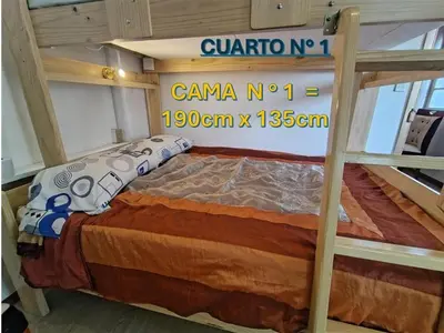 a bedroom with a bunk bed with a sign on it at Centro Historico Lima - Apartamento in Lima