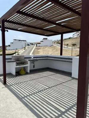 a patio with awning on top of a building at Beach house - Alto Bujama Condominium in Asia