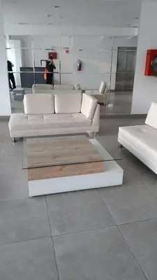 a living room with a white couch and a table at Barranco sea in Lima