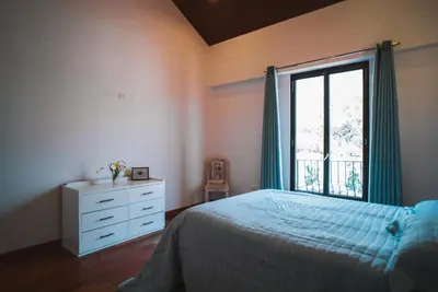 a bedroom with a bed and a window at Casa Julia in Huayllabamba