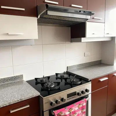 a kitchen with a black stove top oven at E Green View Parking Wifi Pro 4B 904 in Lima