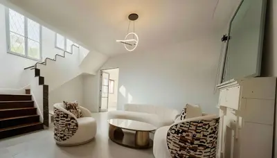 a living room with two chairs and a table at E LidiaHome Boutique Room Miraflores Wifi Pro 1B in Lima
