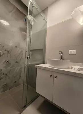 a bathroom with a sink and a shower at E LidiaHome Boutique Room Miraflores Wifi Pro 1B in Lima