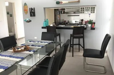 a dining room with a glass table and chairs at Casa de playa 1era fila cala del mar in Salitre