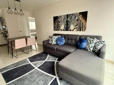 a living room with a couch and a table at Departamento Vizuale in Lima