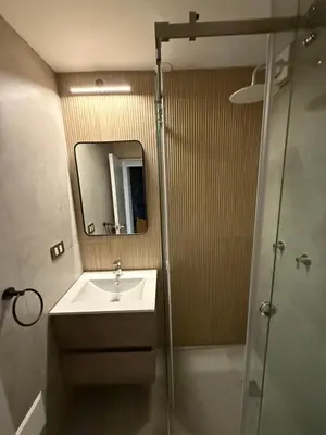 a bathroom with a sink and a shower at Modern and Cozy appartment in Lima