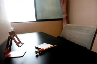 a table with a pen and a lighter on it at Perfect Balance Rest and Work Study Oceanfront in San Antonio