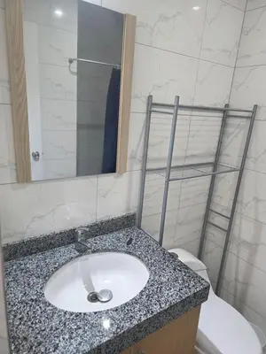 a bathroom with a sink and a toilet at Barranco blue sea in Lima