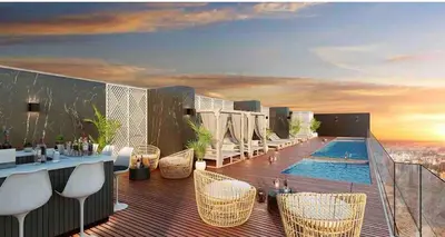 a balcony with a pool and tables and chairs at Lovely Ocean View Apartment 1512 in Lima