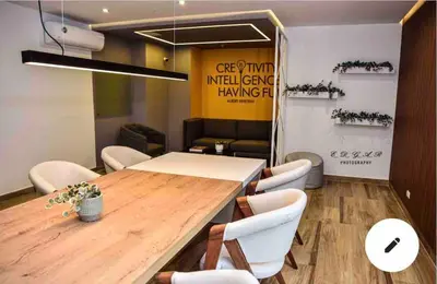a conference room with a wooden table and white chairs at Lovely Ocean View Apartment 1512 in Lima