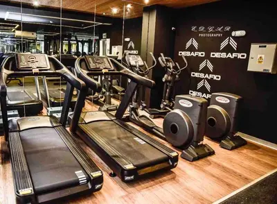 a group of treadmills and exercise bikes in a gym at Lovely Ocean View Apartment 1512 in Lima