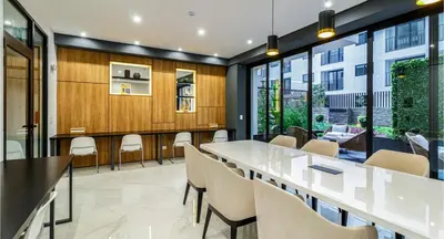 a conference room with a large white table and chairs at Suites Valetine ocean bco in Lima