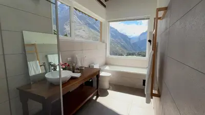 a bathroom with a sink and a tub and a window at Urubamba Luxury Stay 