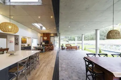a large room with tables and chairs and a living room at Casa de Campo en Cieneguilla in Cieneguilla
