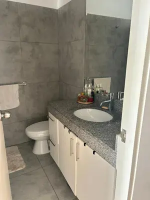 a bathroom with a sink and a toilet at Punta Hermosa in Punta Hermosa