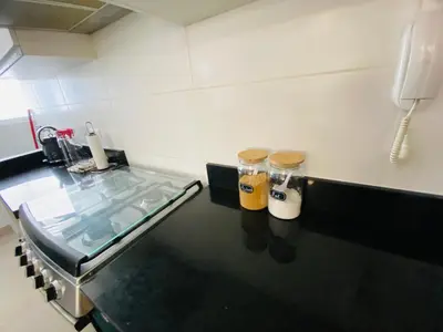a bathroom with a counter with a sink and a phone at Moderno Smart Home San Miguel - Self check in in Lima