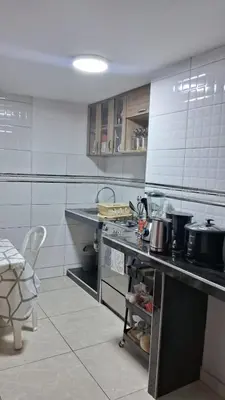 a kitchen with a counter with pots and pans at Relax Department in Lima