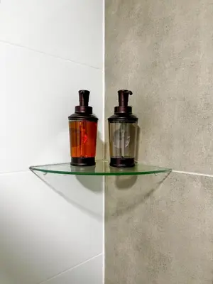 two candles sitting on a glass shelf in a room at New and modern flat in Barranco & Miraflores in Lima
