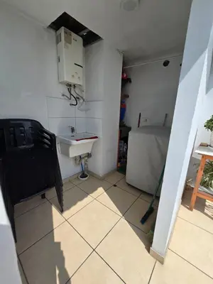 a small room with a sink and a bed at Los Nogales LS in Lima