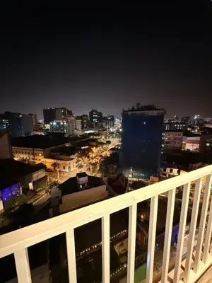 a view of a city at night from a balcony at Beautiful penthouse in the heart of Miraflores in Lima