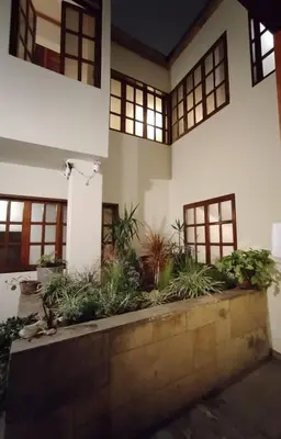 a courtyard of a house with plants at Suite C-1 Wifi 1000 Mbps, recojo gratis aeropuerto in Lima