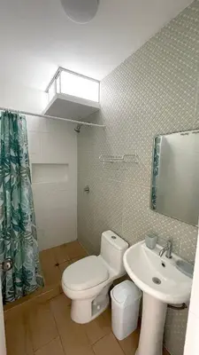 a bathroom with a white toilet and a sink at Casa Playa Azul Verano 2026 Asia in Cerro Azul