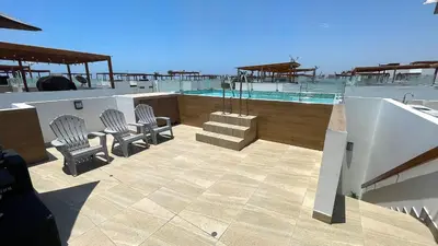 a patio with chairs and a swimming pool at Casa Playa Azul Verano 2026 Asia in Cerro Azul
