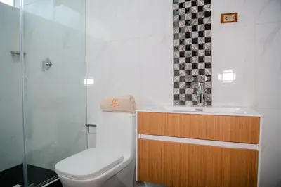a bathroom with a toilet and a sink and a shower at HOTEL TERRANOVA Abancay in Abancay
