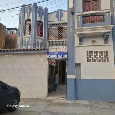 a building with a sign on the side of it at Anciejo inn ll in Lima