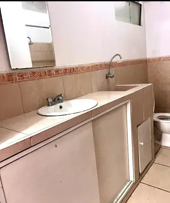 a bathroom with a sink and a mirror at Smart apart in Lima