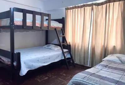 a bedroom with two bunk beds and a bed at Smart apart in Lima