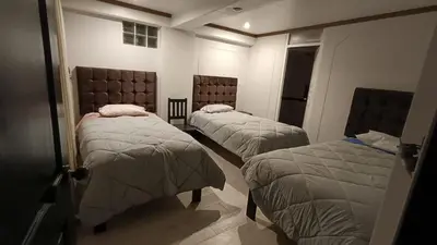 a room with two beds in a room at Hotel Wasichay - Santa teresa in Santa Teresa