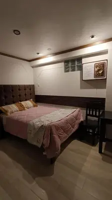 a bedroom with a large bed in a room at Hotel Wasichay - Santa teresa in Santa Teresa