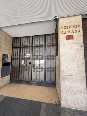 an entrance to a building with a large metal door at Apartment in Lima's historic center in Lima
