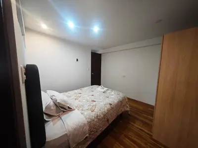 a small bedroom with a bed in a room at Refugio Andino Cusco in Cusco